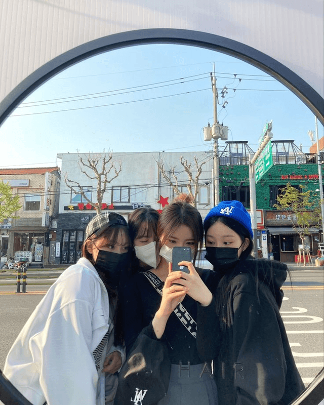 Friends taking a mirror selfie